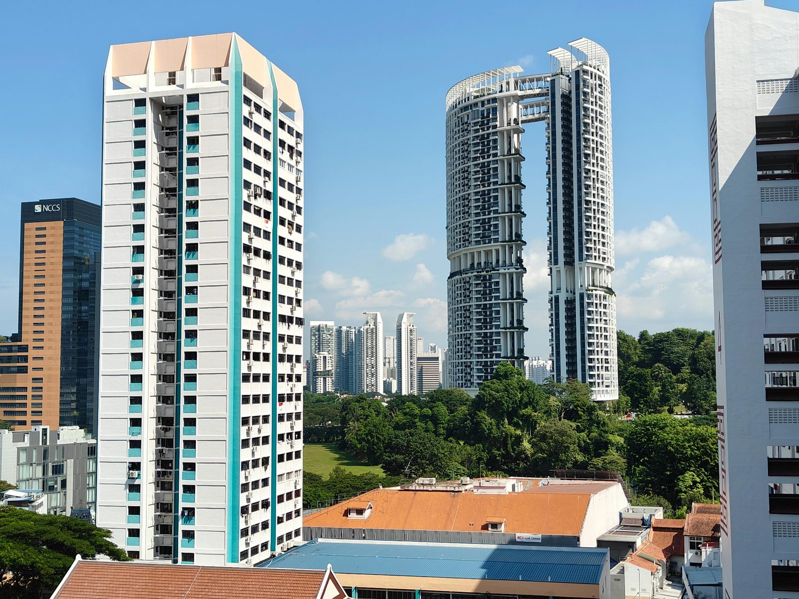 Colourful Singapore residential towers, representing a single listing