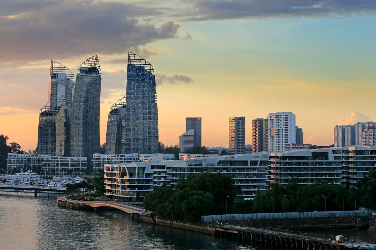 Reflections at Keppel Bay waterfront condominiums in Singapore at sunset